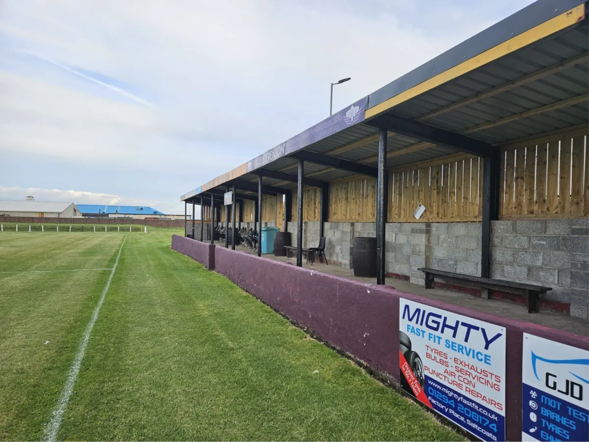 The main stand and pitchside boards at Campbell Park